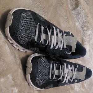 On Running Black Athletic Shoes with Breathable Mesh and Supportive Sole